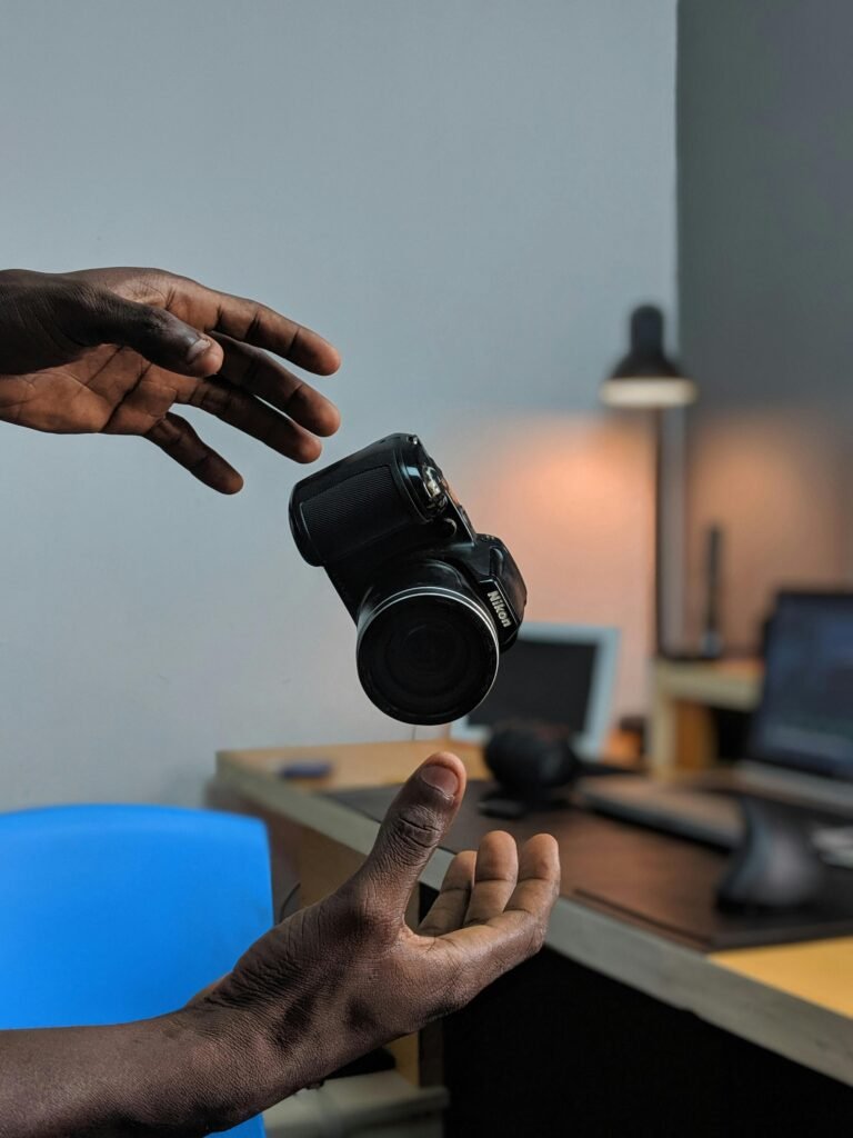 Camera floating in mid-air over a desk, adding a dynamic twist to modern office photography.