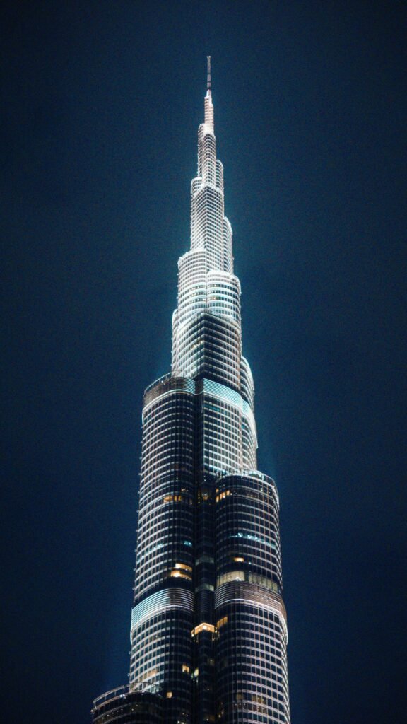 Home A breathtaking night view of the iconic Burj Khalifa, showcasing its architectural brilliance against a dark sky.